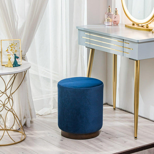 Puff de terciopelo azul con base en madera
